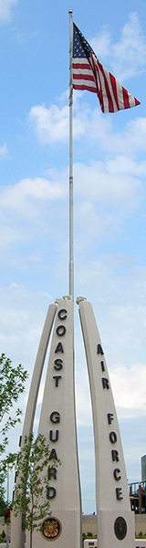 Brown County Veteran's Memorial during the day with the U.S. flag flowing in the wind.